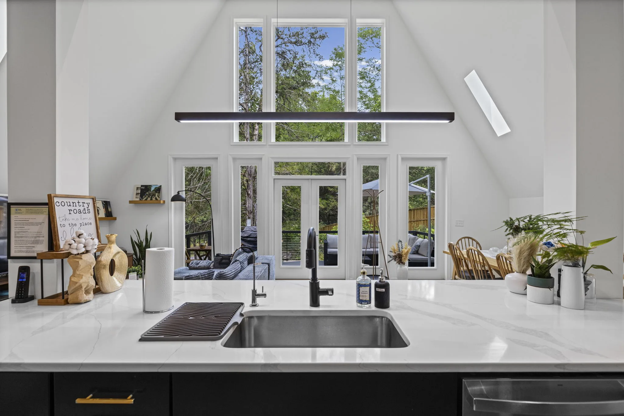 Kitchen counter overlooking the A-frame living and dining space