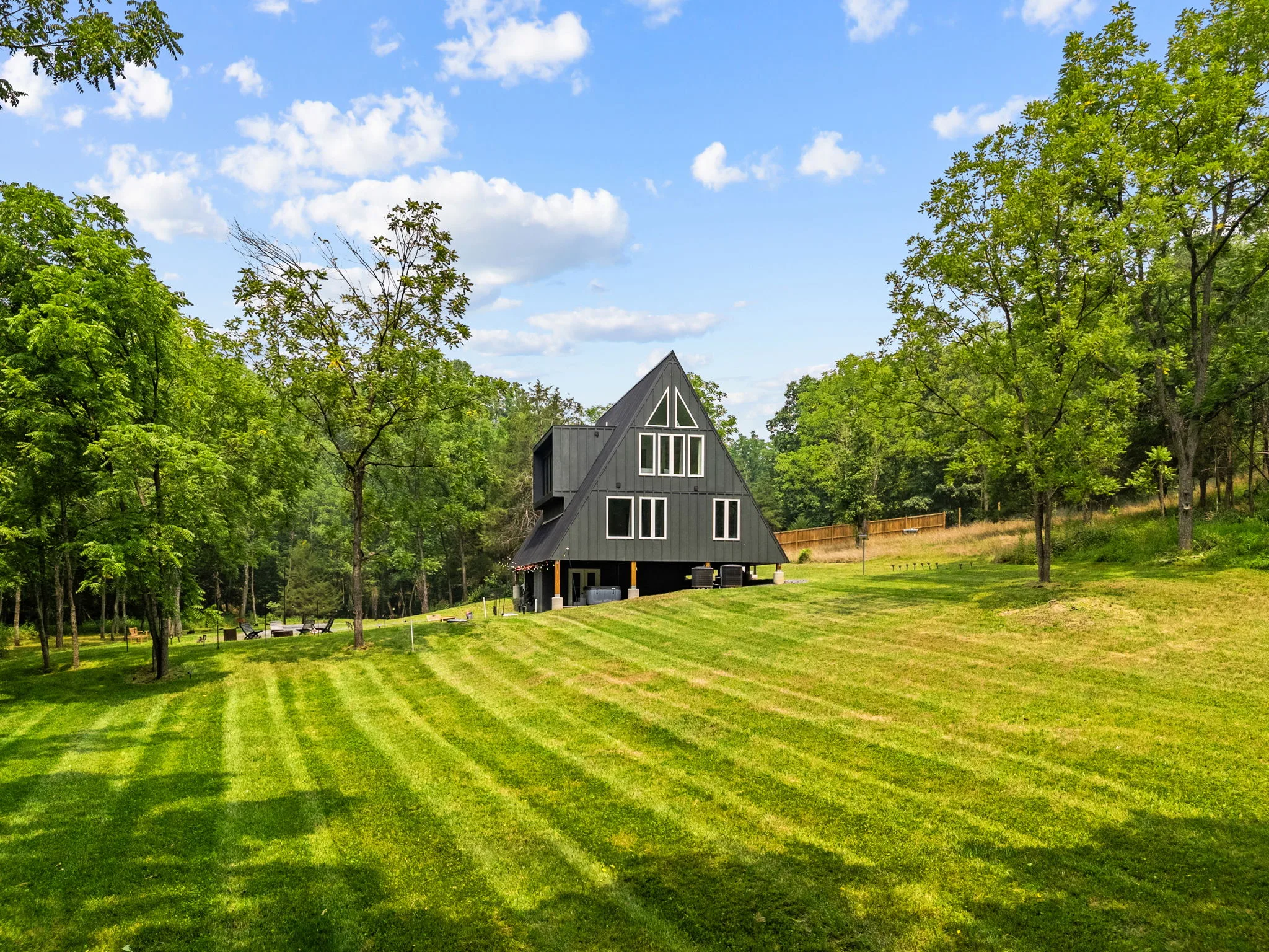 The A-frame Chalet set within a large private wooded lawn
